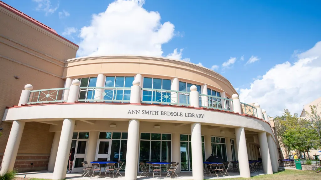 Wideangle photo of the Ann Smith Bedsole Library exterior